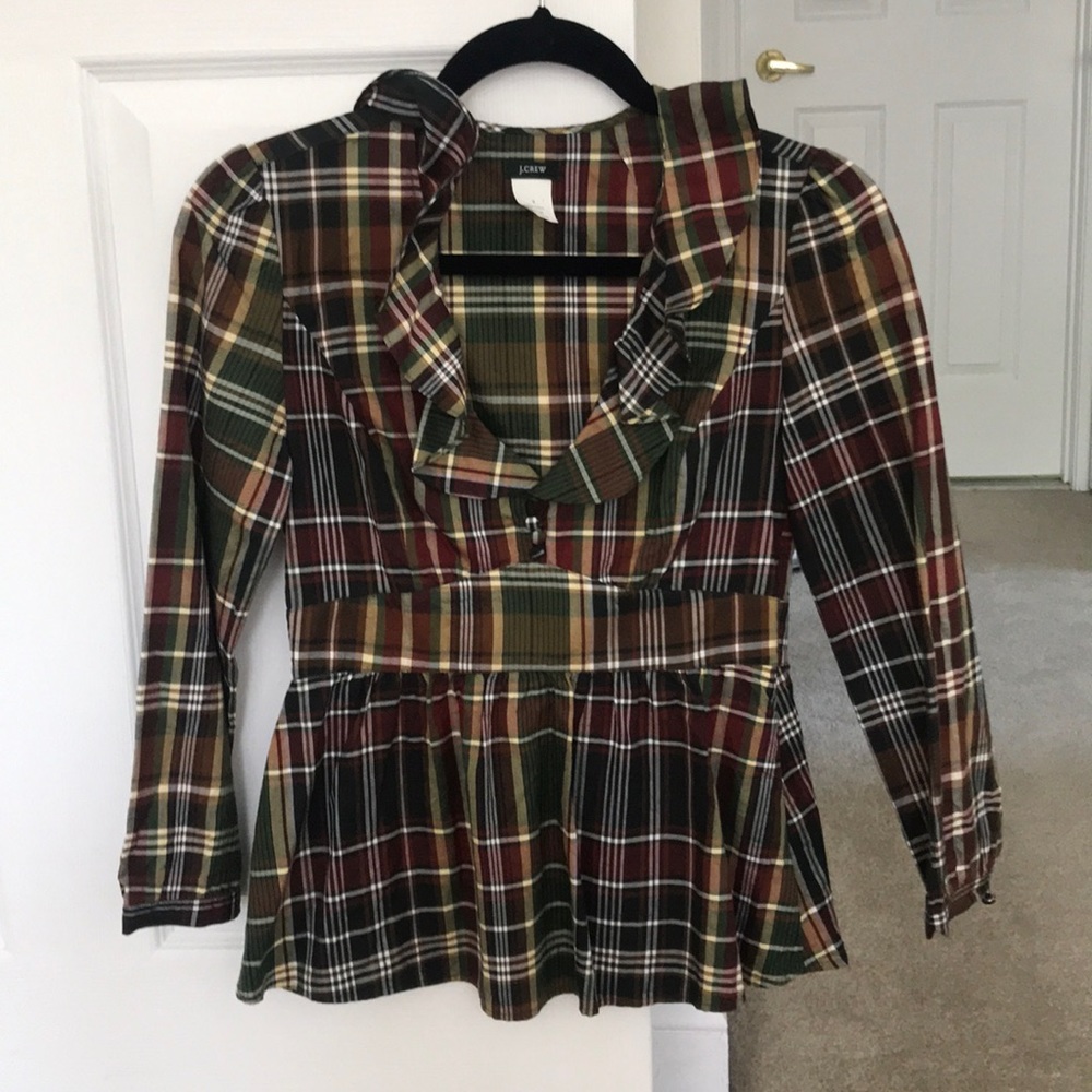 Elegant, plaid blouse with ruffles